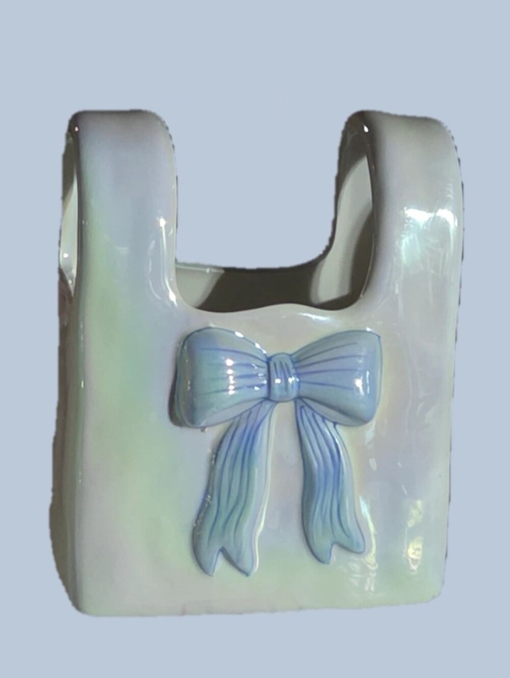 Iridescent ceramic purse vase. Spring 2025